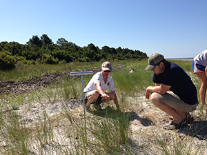 Charlotte Hope & DNR team member find a nest on a remote beach