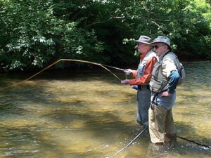 Kevin's father Ray (orange shirt) on his Reel Recovery retreat